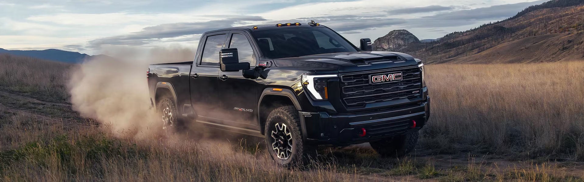 GMC Sierra 2500HD 2026 heavy-duty truck in motion off road at Riverview GMC North Huntingdon, PA