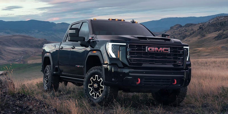 Black GMC Sierra 2500HD heavy-duty truck parked outdoors at Riverview GMC North Huntingdon, PA